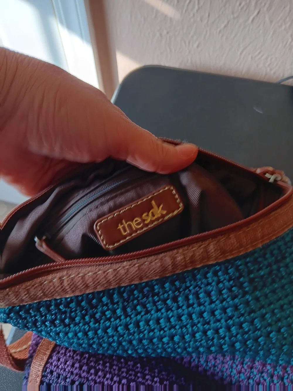 The SAK Woven Striped Crossbody Bag in Teal, Purple and Brown